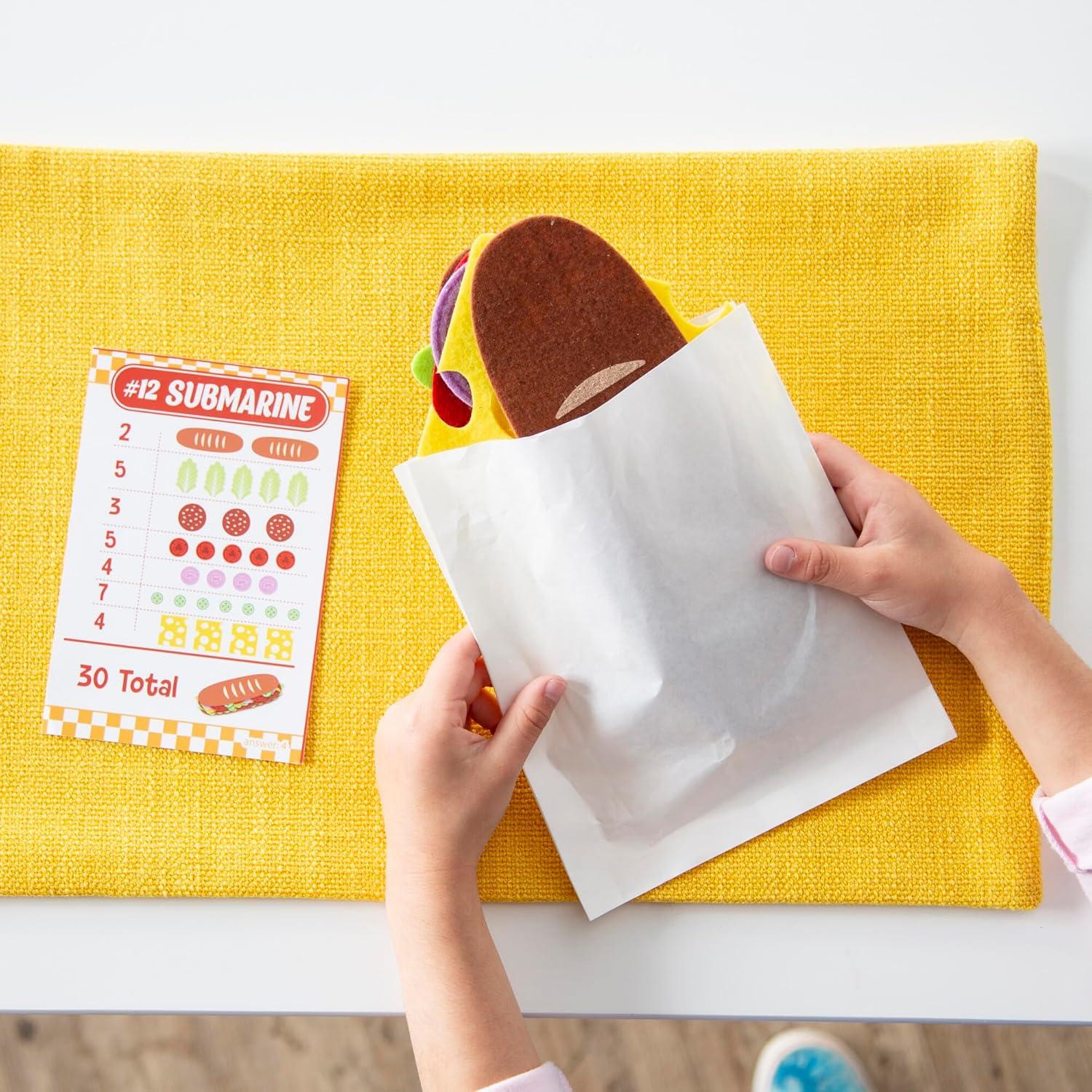 imagePeaceable Kingdom Math Sandwich Game Preschool Math Games for Kids Ages 3 and Up Includes 100 Felt Food Pieces 10 Menu Cards Dry Erase Marker amp Guest Check Tablet for Pretend Restaurant Play